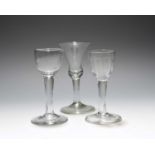 Three wine glasses, c.1750-60, one with a cup bowl, another a bell bowl, the last with a moulded