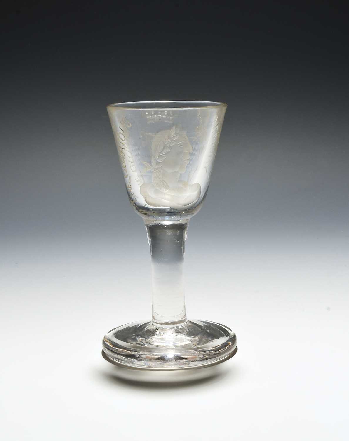 A Williamite firing glass, c.1760, engraved with a portrait of the King within the inscription '