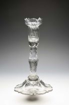 An unusual cut and moulded glass candlestick, late 18th century, the sconce moulded with vertical