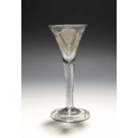 A Jacobite wine glass of Scottish significance, c.1750, the drawn trumpet bowl engraved with a