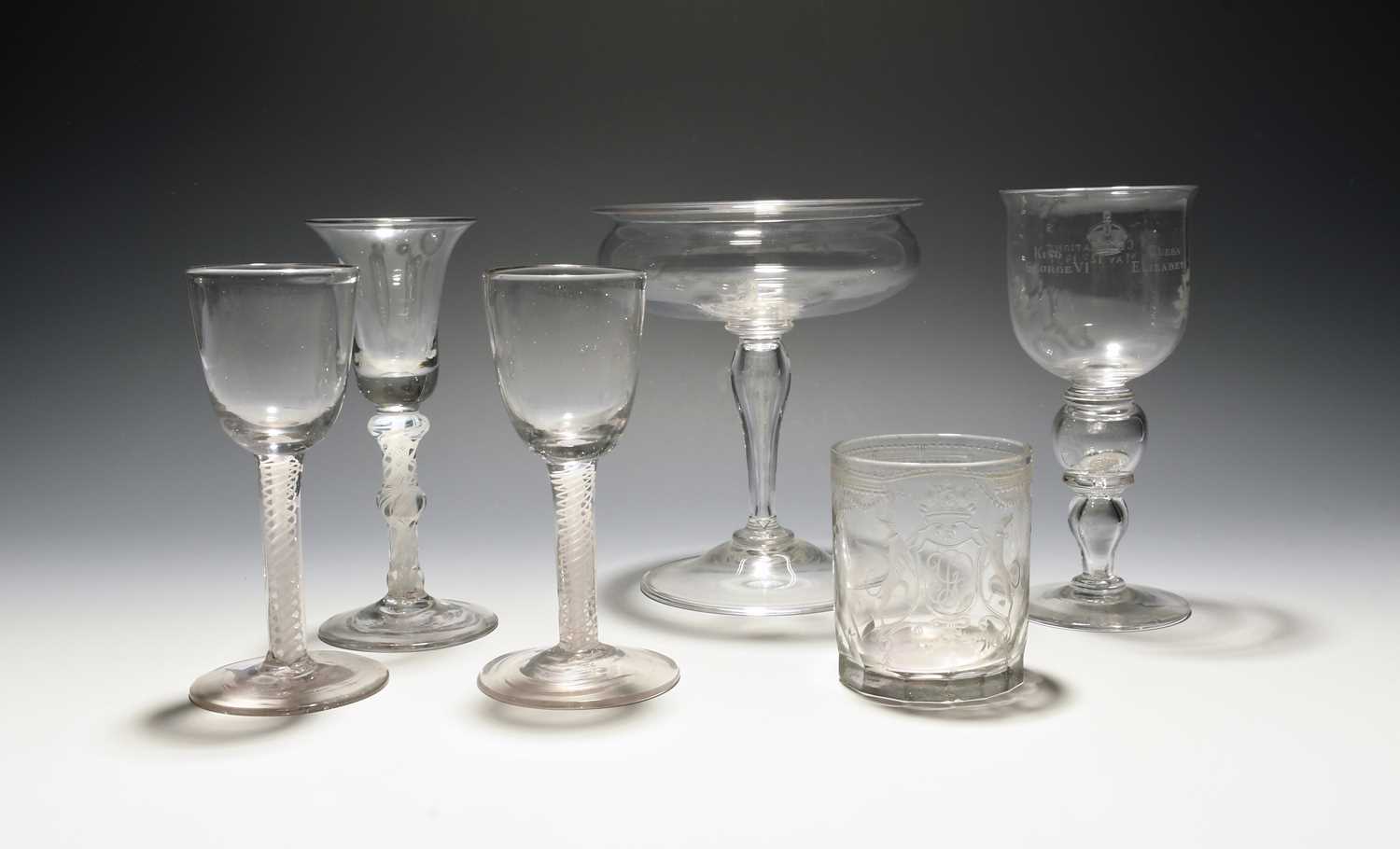 Three wine glasses, mid 18th century, one English with a bell bowl, two Continental with round