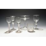 Three wine glasses, mid 18th century, one English with a bell bowl, two Continental with round