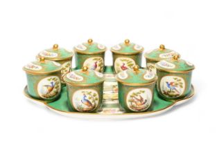 A Continental porcelain set of eight custard cups and covers with stand, late 19th century,