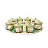 A Continental porcelain set of eight custard cups and covers with stand, late 19th century,