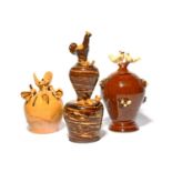 Three slipware money boxes, 19th century, one probably Yorkshire, decorated in cream slip and