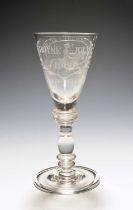 A Williamite wine glass, probably early 18th century, the flared bowl engraved with an equestrian