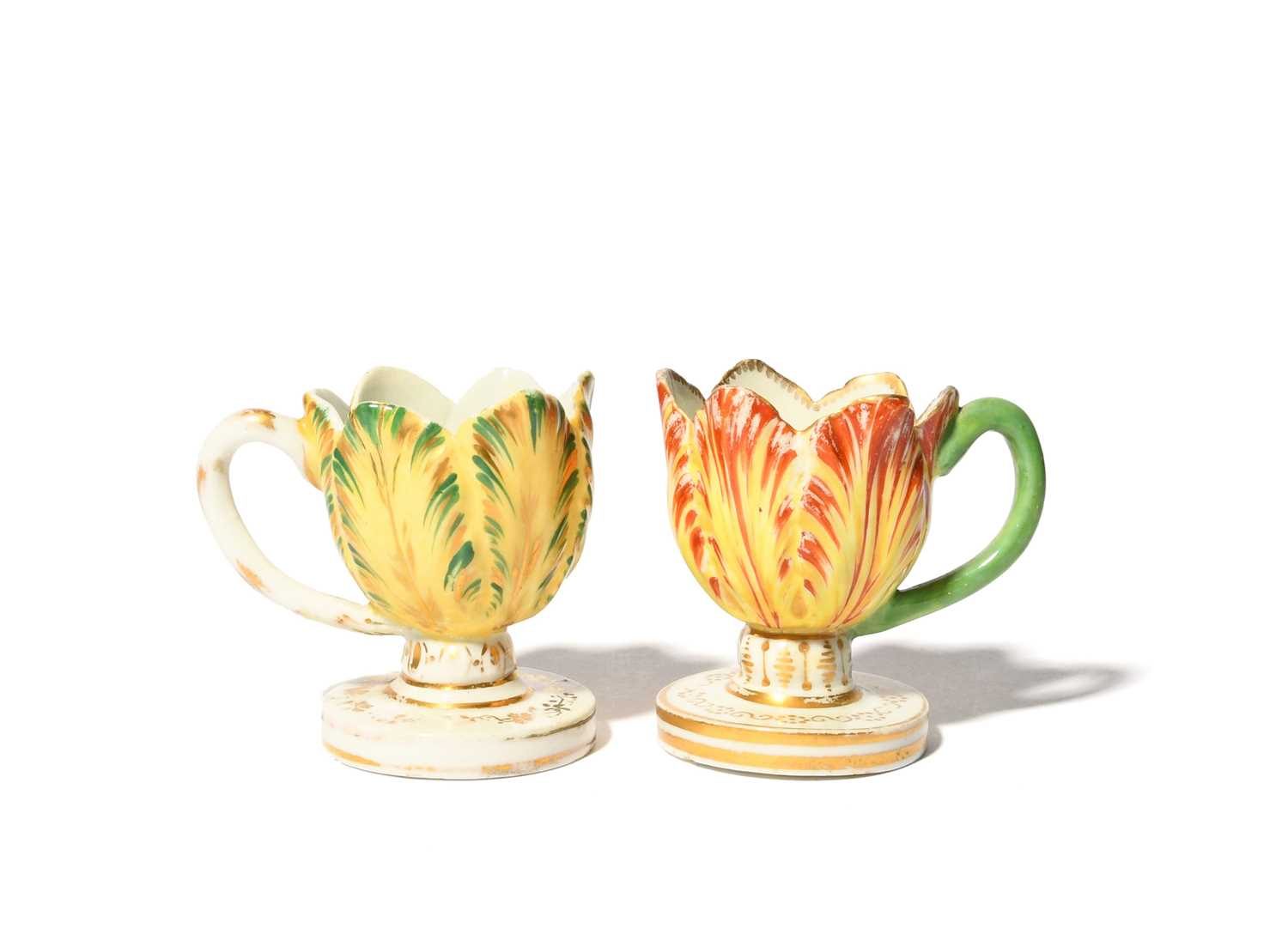 A pair of Derby tulip cups, c.1815, on circular feet, each modelled as a six-petalled tulip picked