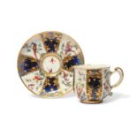 A Chelsea cabinet cup and saucer, c.1760-65, finely decorated with panels of colourful birds perched