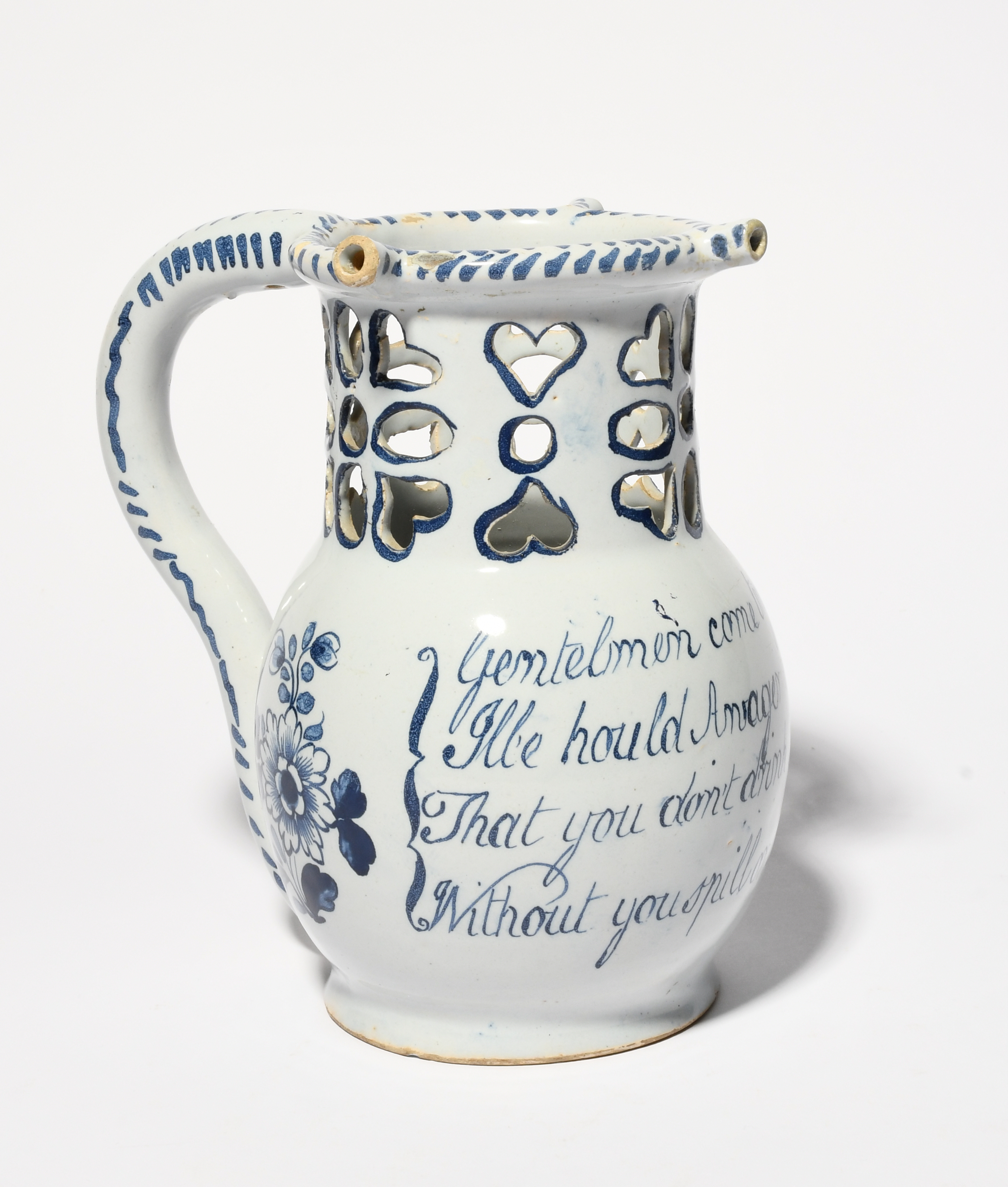 A delftware puzzle jug, c.1760, probably Liverpool, painted with flower sprays flanking a four - Image 2 of 2
