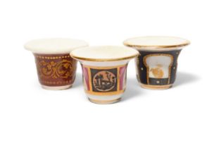 Three Paris porcelain rouge pots, c.1800-30, one decorated with a gilt foliate scroll band on a