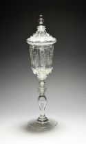 A Bohemian or Czechoslovakian glass goblet and cover, late 19th century, the panelled flared bowl