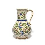 A Zsolnay Iznik style jug, late 19th century, painted in typical palette of blue, green and dark red