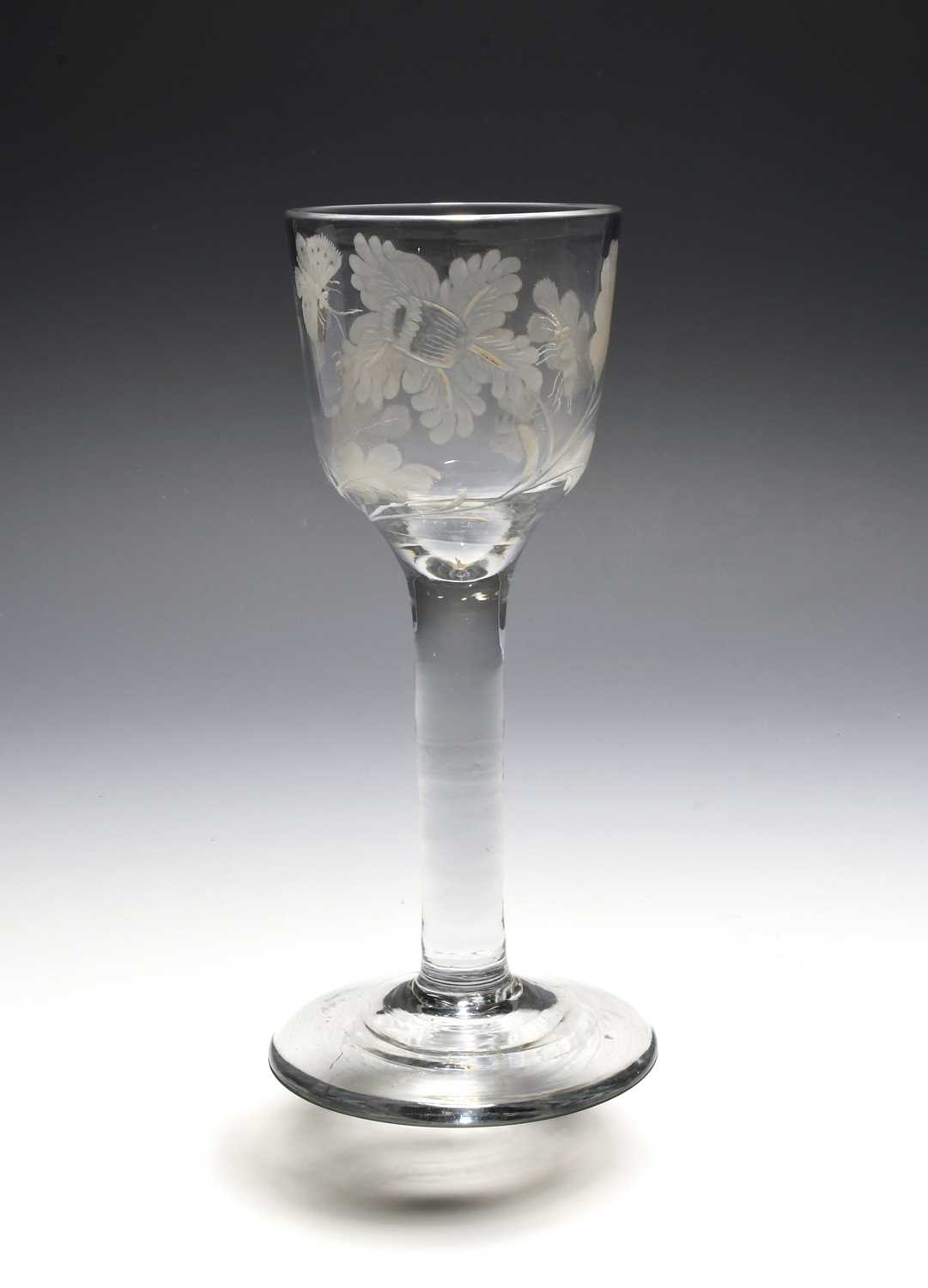 An unusual wine glass of Jacobite significance, c.1750-60, the deep ogee bowl engraved with a