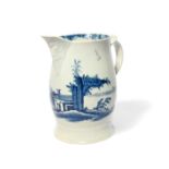 A William Reid blue and white jug, c.1756-58, the barrel shape painted with low buildings and a
