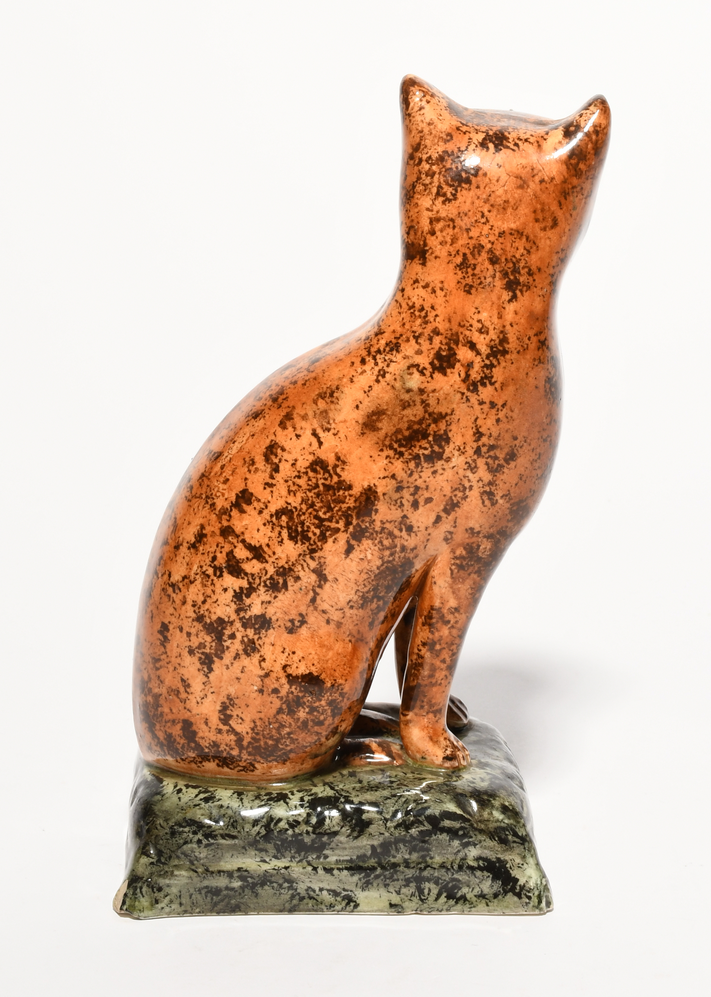 A rare pearlware figure of a cat, early 19th century, seated on its haunches with head turned to the - Image 2 of 2