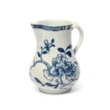 A good William Reid (Liverpool) blue and white milk jug, c.1756-58, painted with a large spray of