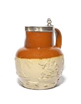 A silver-mounted brown stoneware jug, dated 1874, sprigged with George slaying the dragon, a