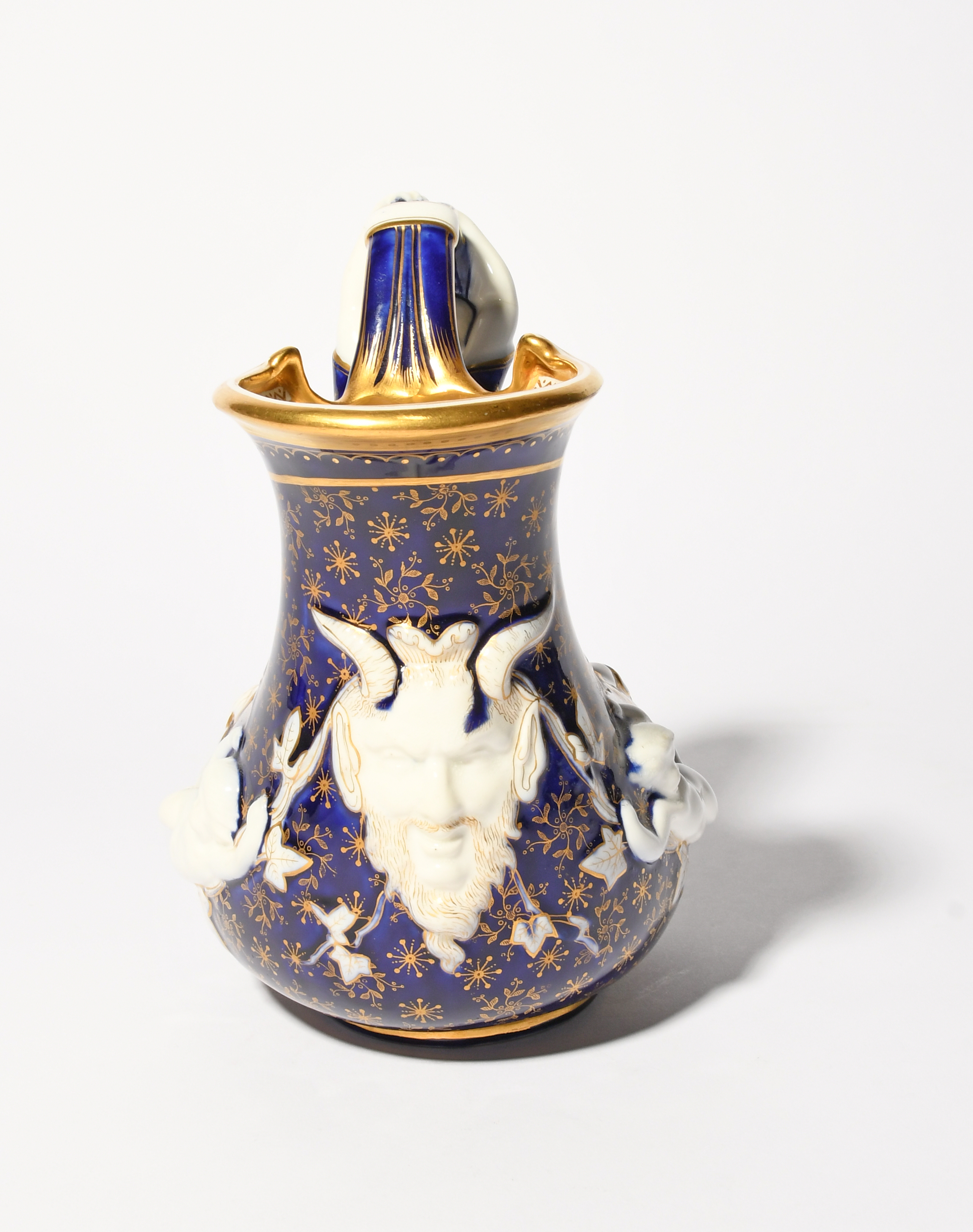 A rare Minton porcelain 'Mermaid' ewer, c.1880, of askos shape, moulded with putti and a horned - Image 4 of 5