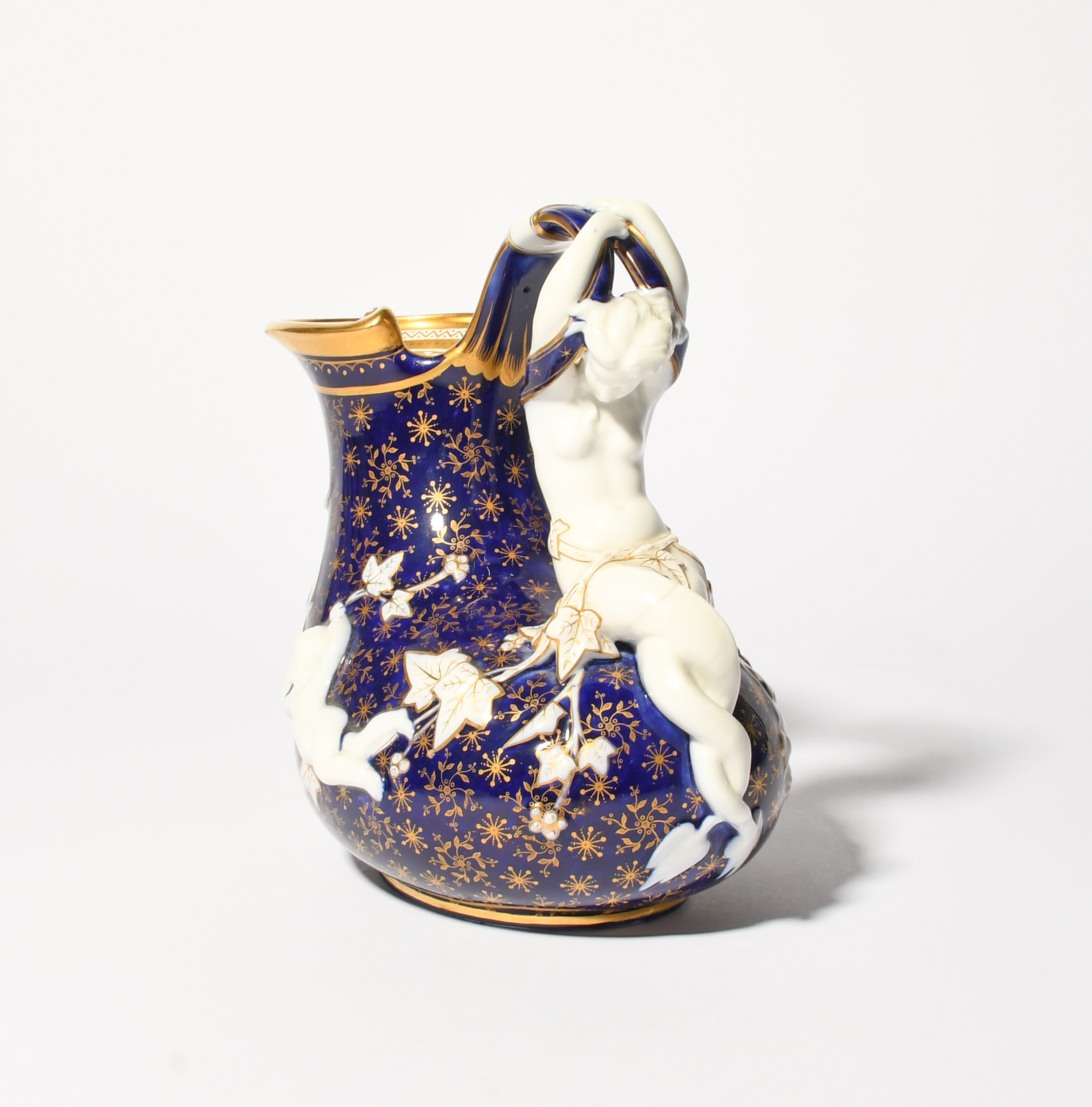 A rare Minton porcelain 'Mermaid' ewer, c.1880, of askos shape, moulded with putti and a horned - Image 2 of 5