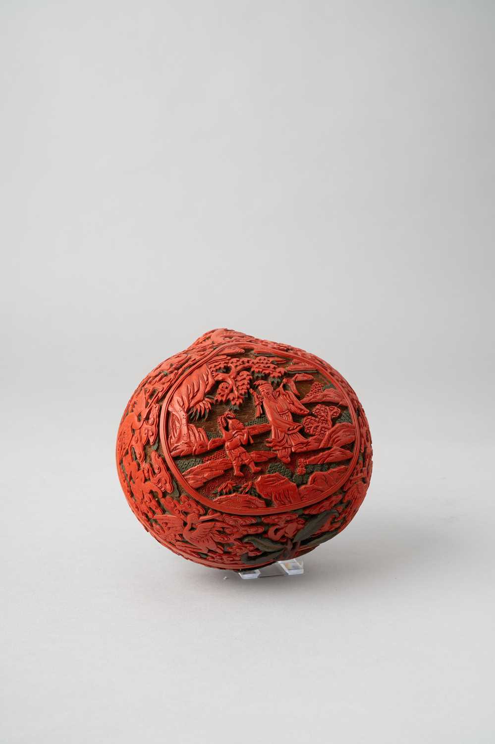A CHINESE THREE-COLOUR LACQUER PEACH-SHAPED BOX AND COVER QIANLONG 1736-95 The cover carved with