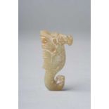 A CHINESE YELLOW JADE 'DRAGON' PENDANT POSSIBLY SHANG DYNASTY Carved as a stylised dragon