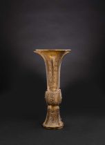 A CHINESE PARCEL-GILT BRONZE ARCHAISTIC BEAKER VASE, GU 17TH CENTURY In the manner of Hu Wenming,