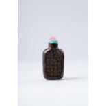 A CHINESE AVENTURINE-SPLASHED BROWN GLASS SNUFF BOTTLE QING DYNASTY The compressed rectangular