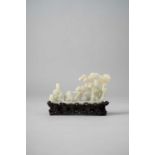 A CHINESE PALE CELADON JADE CARVING OF A RAFT QING DYNASTY Depicting Magu dressed in elegant flowing
