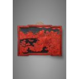 AN EXTREMELY RARE CHINESE IMPERIAL CARVED RED, GREEN AND BLUE LACQUER ‘DAOIST PARADISE’ LANDSCAPE