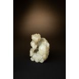 A RARE CHINESE CREAMY-WHITE JADE CHIMERA SONG-MING DYNASTY The chimera is strongly carved and seated