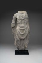 A GANDHARAN GREY SCHIST TORSO OF A BODHISATTVA 2ND/3RD CENTURY AD Carved standing in a