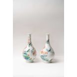 A PAIR OF CHINESE FAMILLE VERTE BOTTLE VASES KANGXI 1662-1722 The pear-shaped bodies and slender