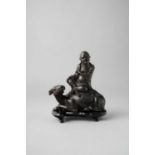 A CHINESE BRONZE 'LAOZI AND BUFFALO' GROUP MING DYNASTY The Daoist sage wears flowing robes and