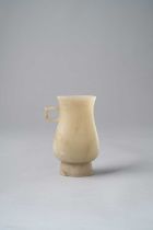 A RARE CHINESE PALE CELADON JADE ARCHAISTIC RITUAL VESSEL, ZHI SONG-MING DYNASTY Of flattened