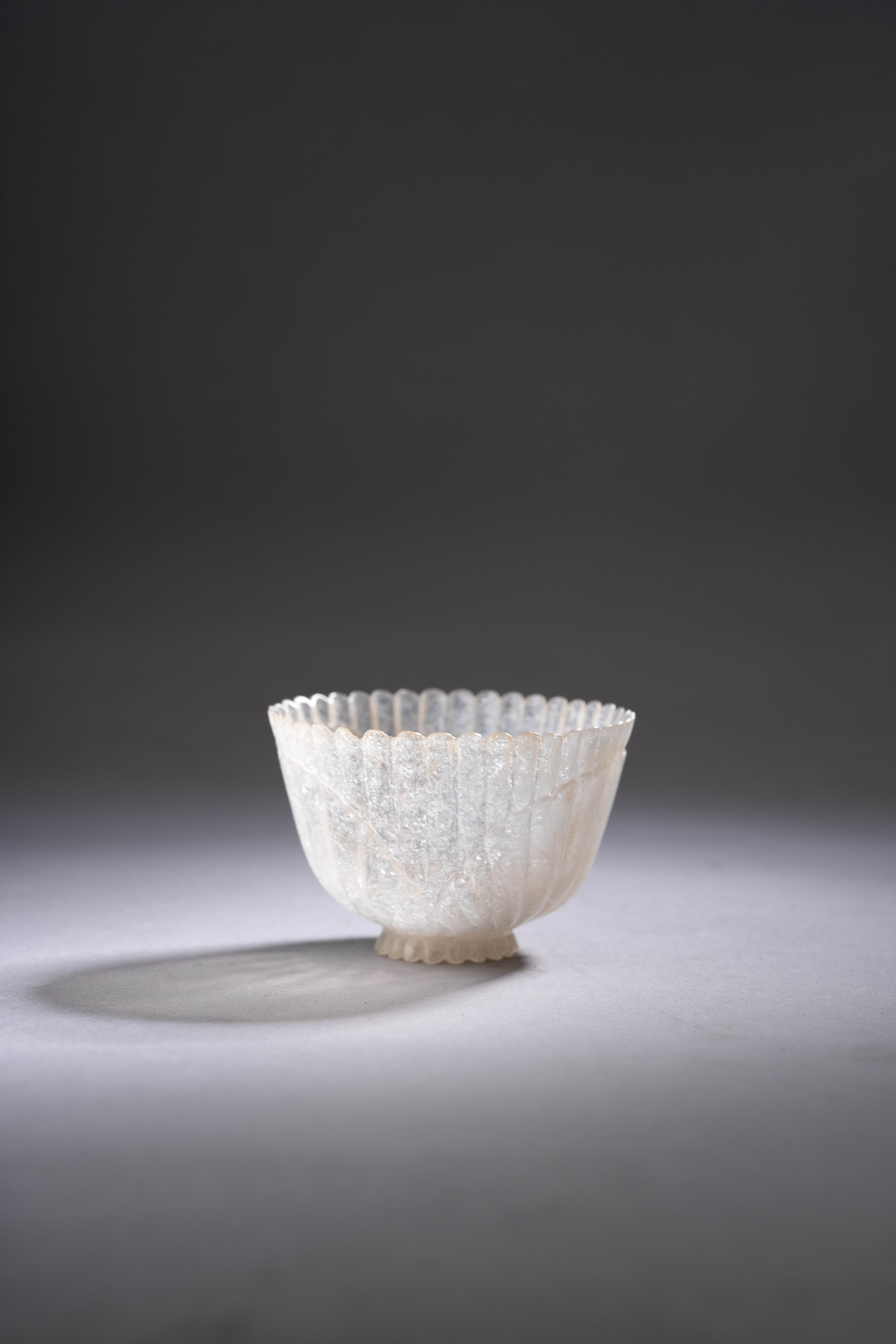 A RARE MINIATURE WHITE JADEITE MUGHAL-STYLE CUP 18TH/19TH CENTURY Finely carved as a chrysanthemum