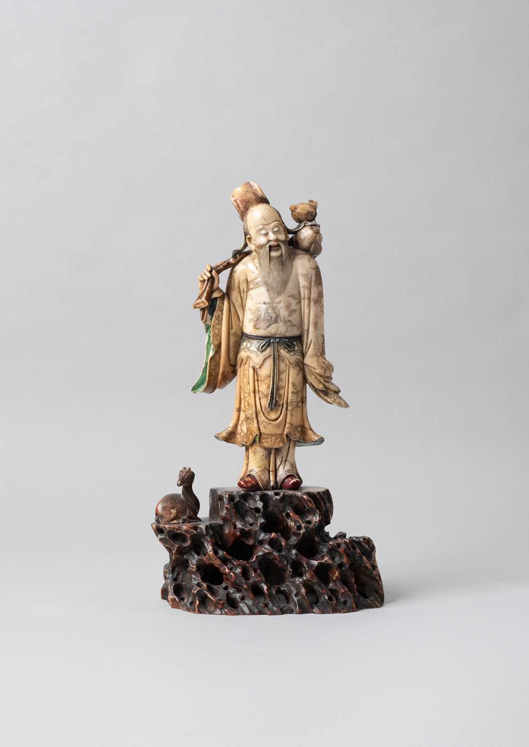 A LARGE CHINESE SOAPSTONE FIGURE OF SHOULAO 17TH CENTURY The God of Longevity with his distinctive