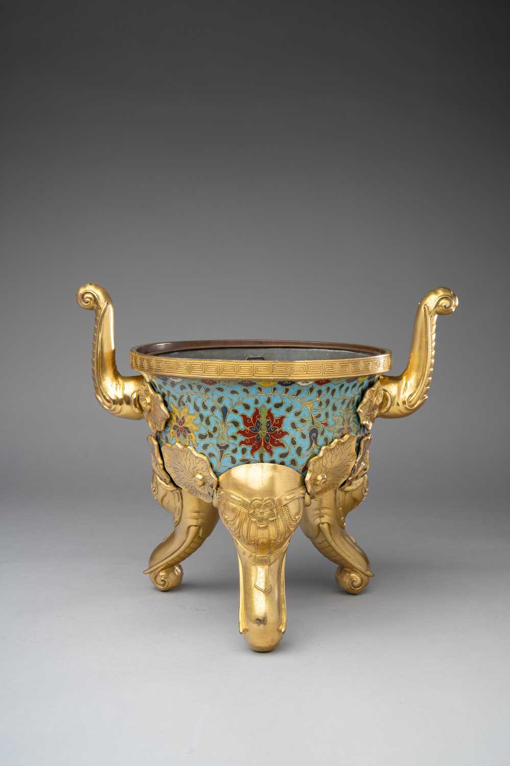 A CHINESE CLOISONNE ENAMEL AND GILT-BRONZE TRIPOD INCENSE BURNER QIANLONG OR LATER The vessel with