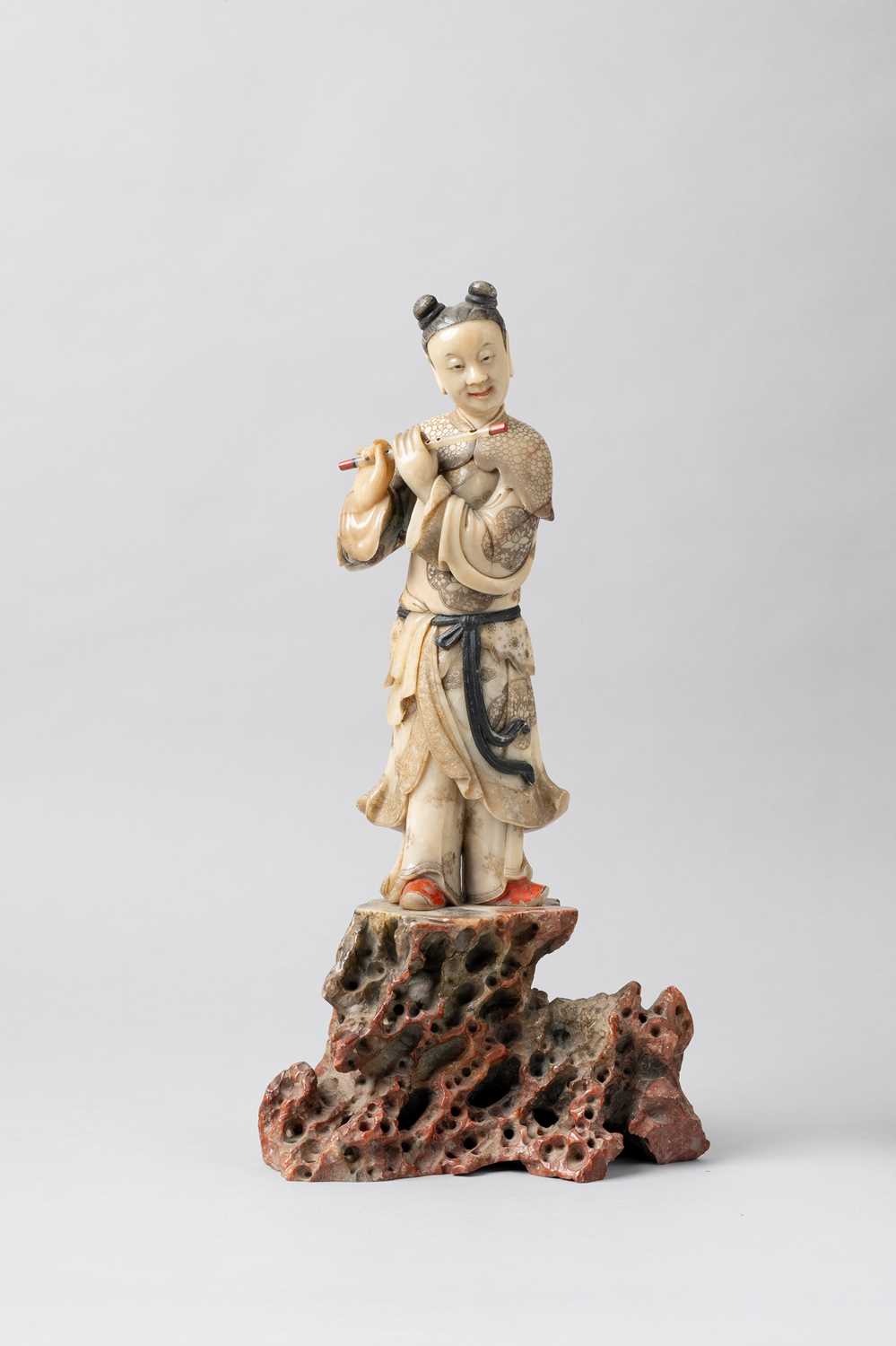 A LARGE CHINESE SOAPSTONE FIGURE OF HAN XIANGZI 17TH CENTURY The Daoist Immortal carved standing