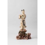 A LARGE CHINESE SOAPSTONE FIGURE OF HAN XIANGZI 17TH CENTURY The Daoist Immortal carved standing