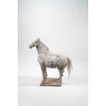A MASSIVE CHINESE POTTERY HORSE TANG DYNASTY The horse depicted standing proudly four-square on a