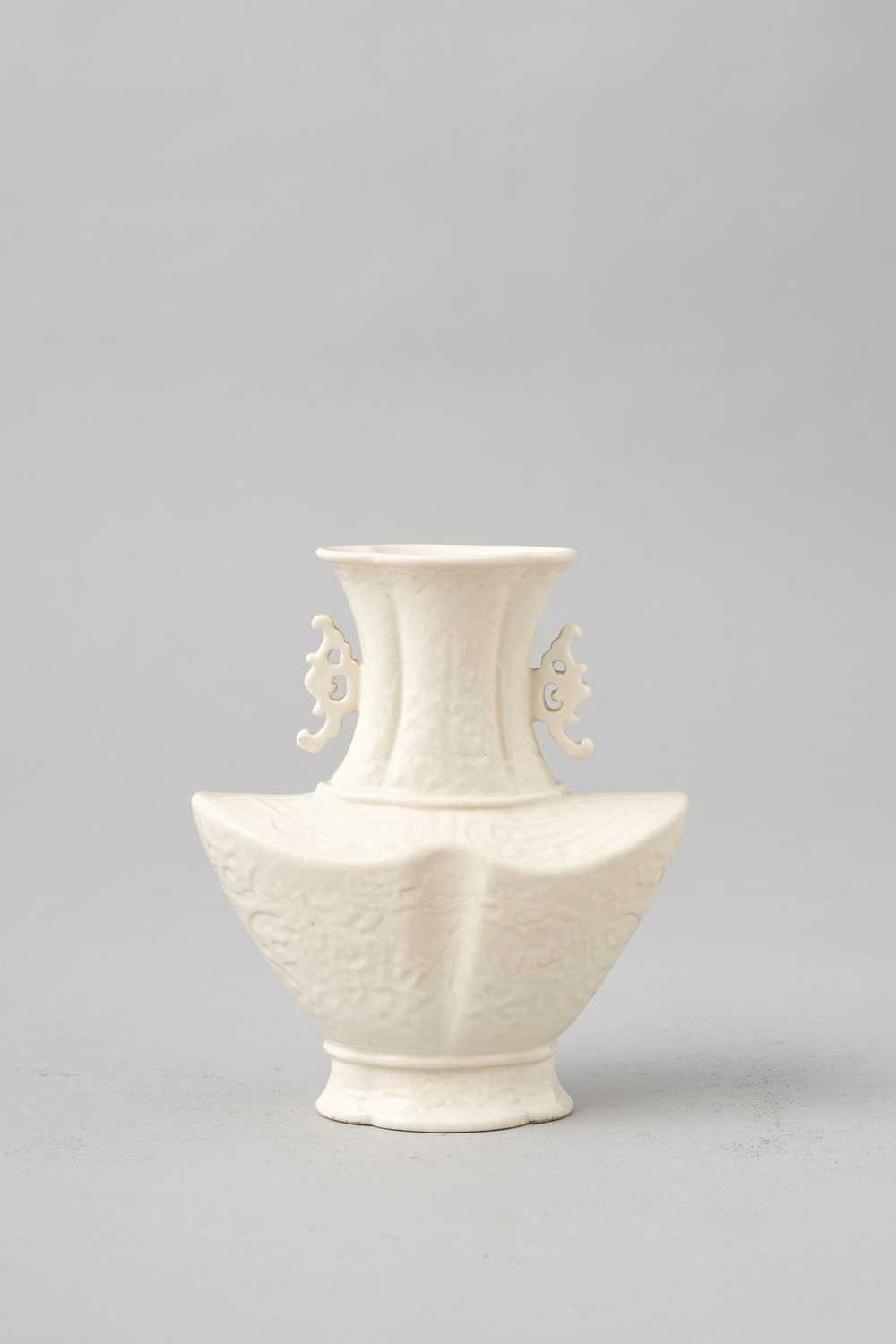 A RARE CHINESE SOFT-PASTE WHITE-GLAZED VASE 18TH CENTURY The ingot-shaped body with sharp