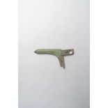 A CHINESE BRONZE DAGGER-AXE, GE EASTERN ZHOU DYNASTY The bronze L-shaped curved blade with a