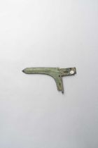 A CHINESE BRONZE DAGGER-AXE, GE EASTERN ZHOU DYNASTY The bronze L-shaped curved blade with a