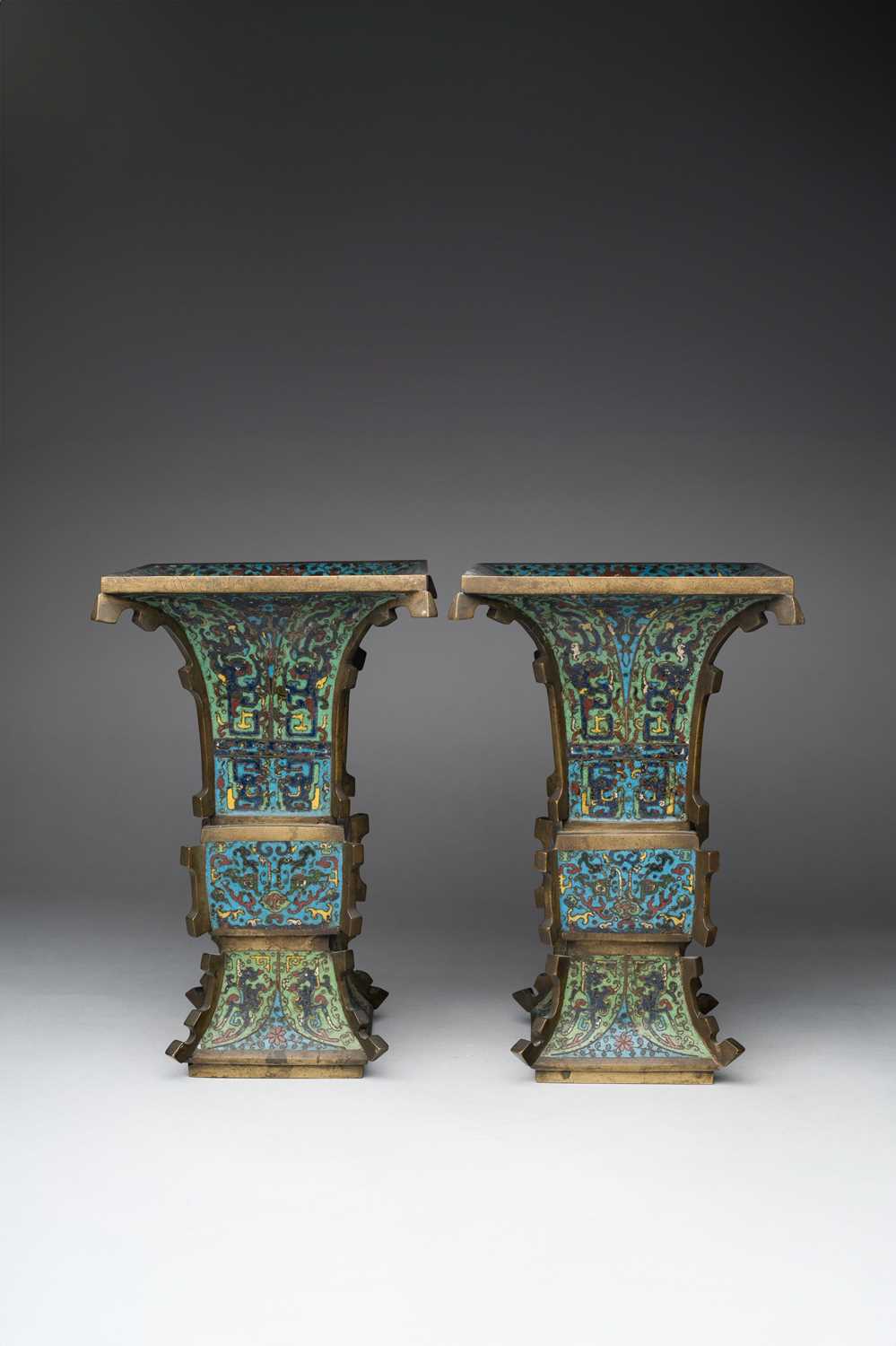 A GOOD PAIR OF CHINESE CLOISONNE ENAMEL ARCHAISTIC VASES, FANGGU 17TH CENTURY Decorated to the