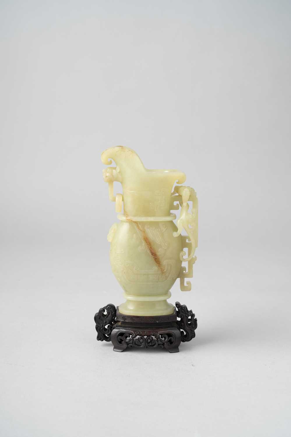 A GOOD CHINESE YELLOW JADE EWER, GONG QIANLONG 1736-95 The pouring vessel of oval-section, carved in