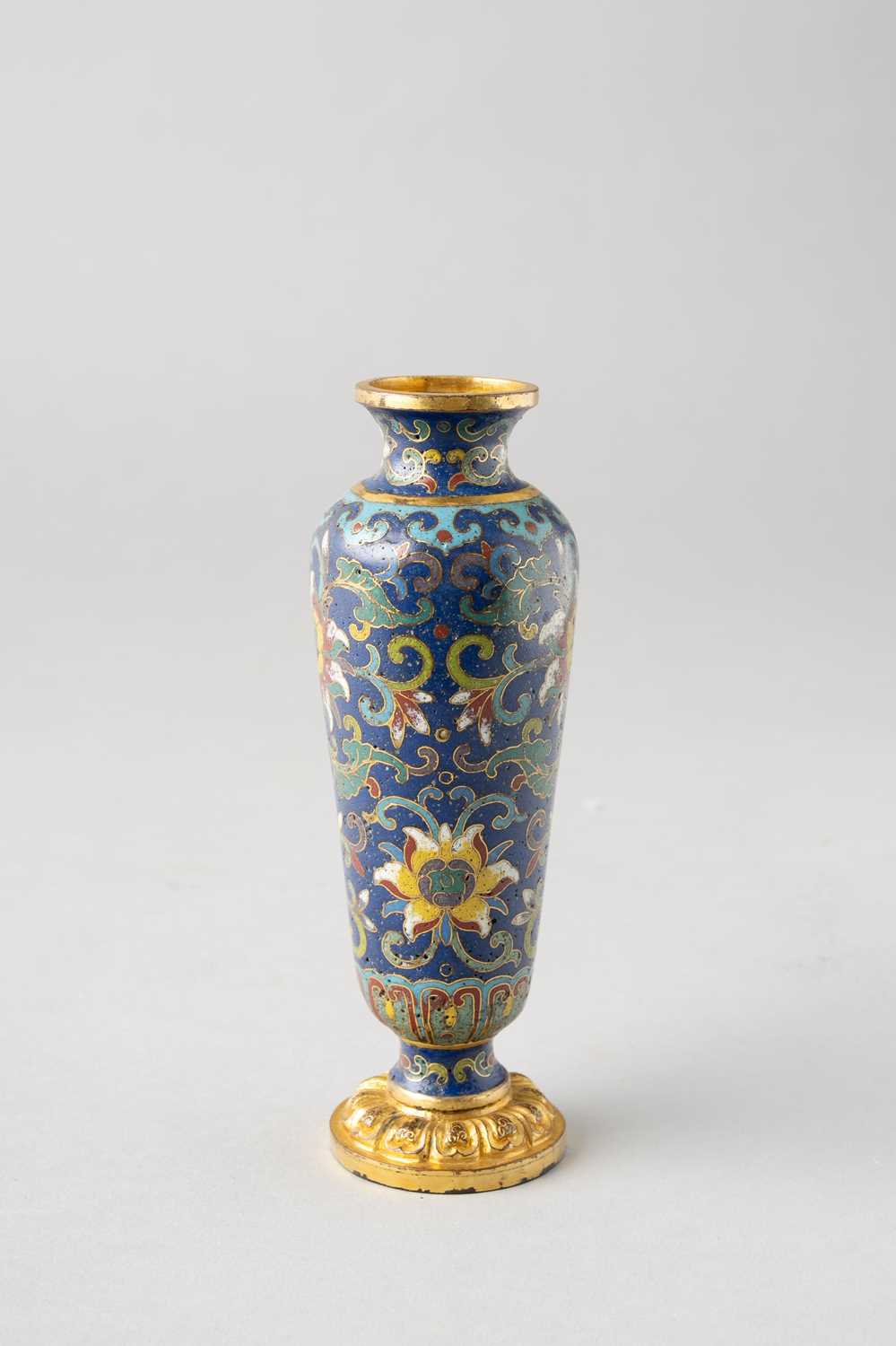 A TALL CHINESE CLOISONNE ENAMEL 'LOTUS' VASE 18TH CENTURY The slender body tapering towards a gently