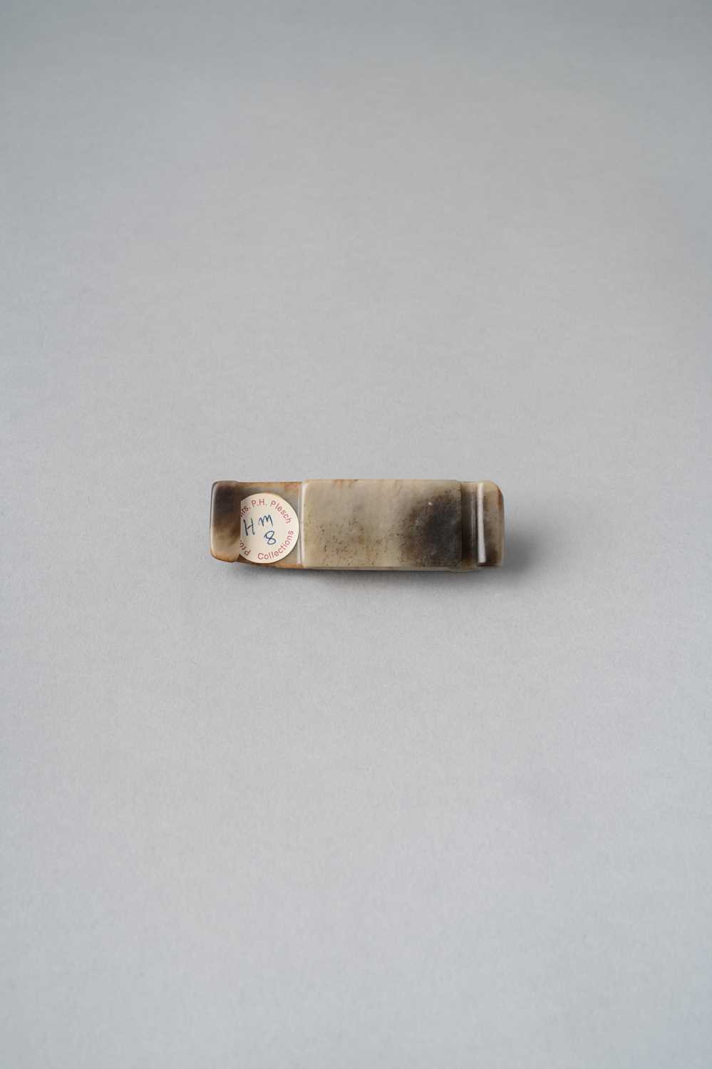 A CHINESE CELADON AND RUSSET JADE 'CHILONG' SCABBARD SLIDE, JIANCHI HAN DYNASTY The creamy stone - Image 2 of 3