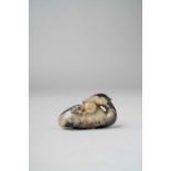 A CHINESE JADE CARVING OF A MANDARIN DUCK MING DYNASTY Carved sitting with its feet tucked under its