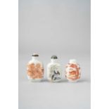 THREE CHINESE SNUFF BOTTLES LATE QING DYNASTY One decorated with two dragons chasing flaming pearls,