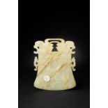 A CHINESE CELADON JADE BELL-SHAPED RITUAL PLAQUE, YUE MING/EARLY QING DYNASTY The plaque carved on